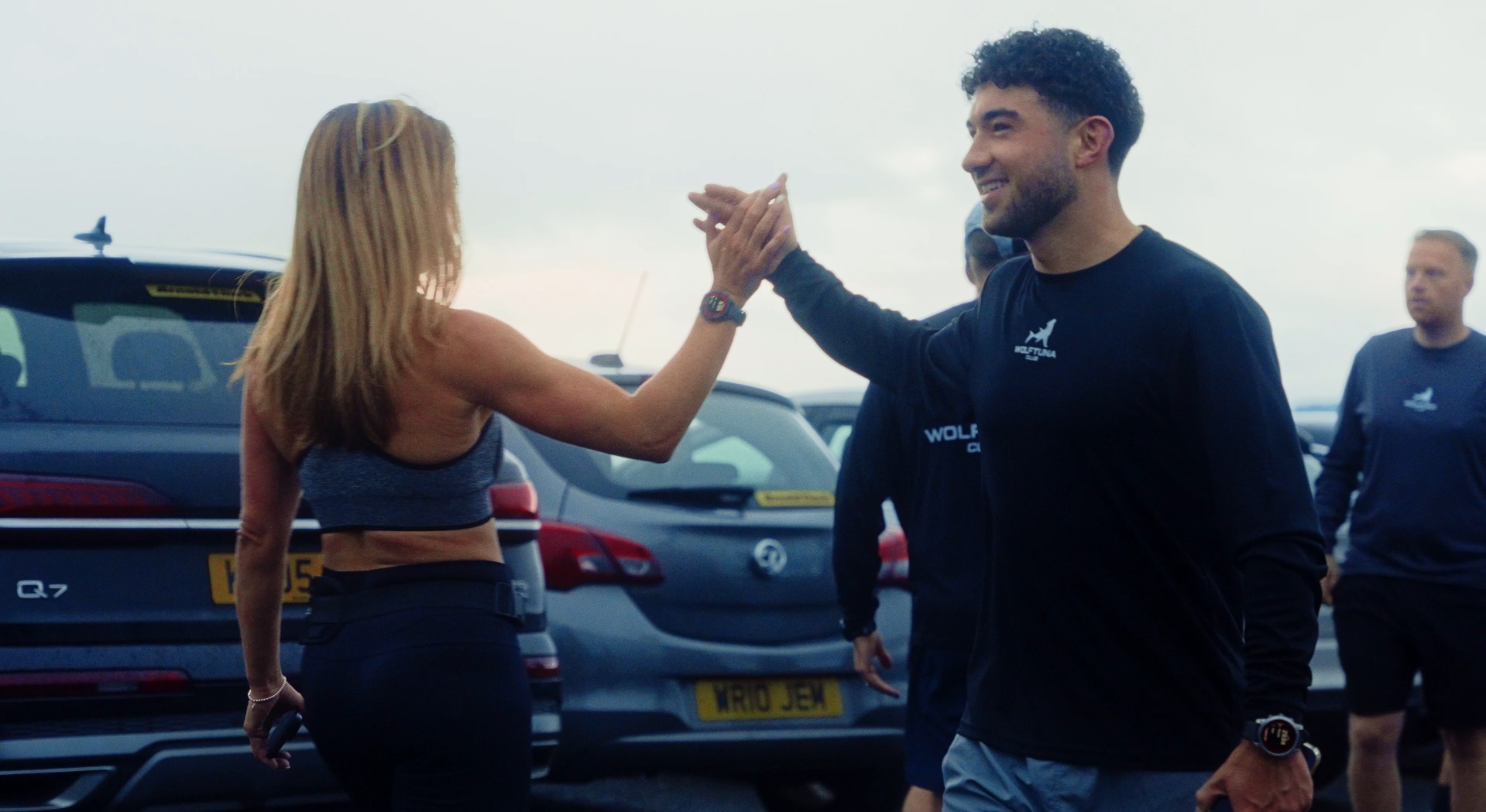 Wolftuna Club members high-fiving after a run